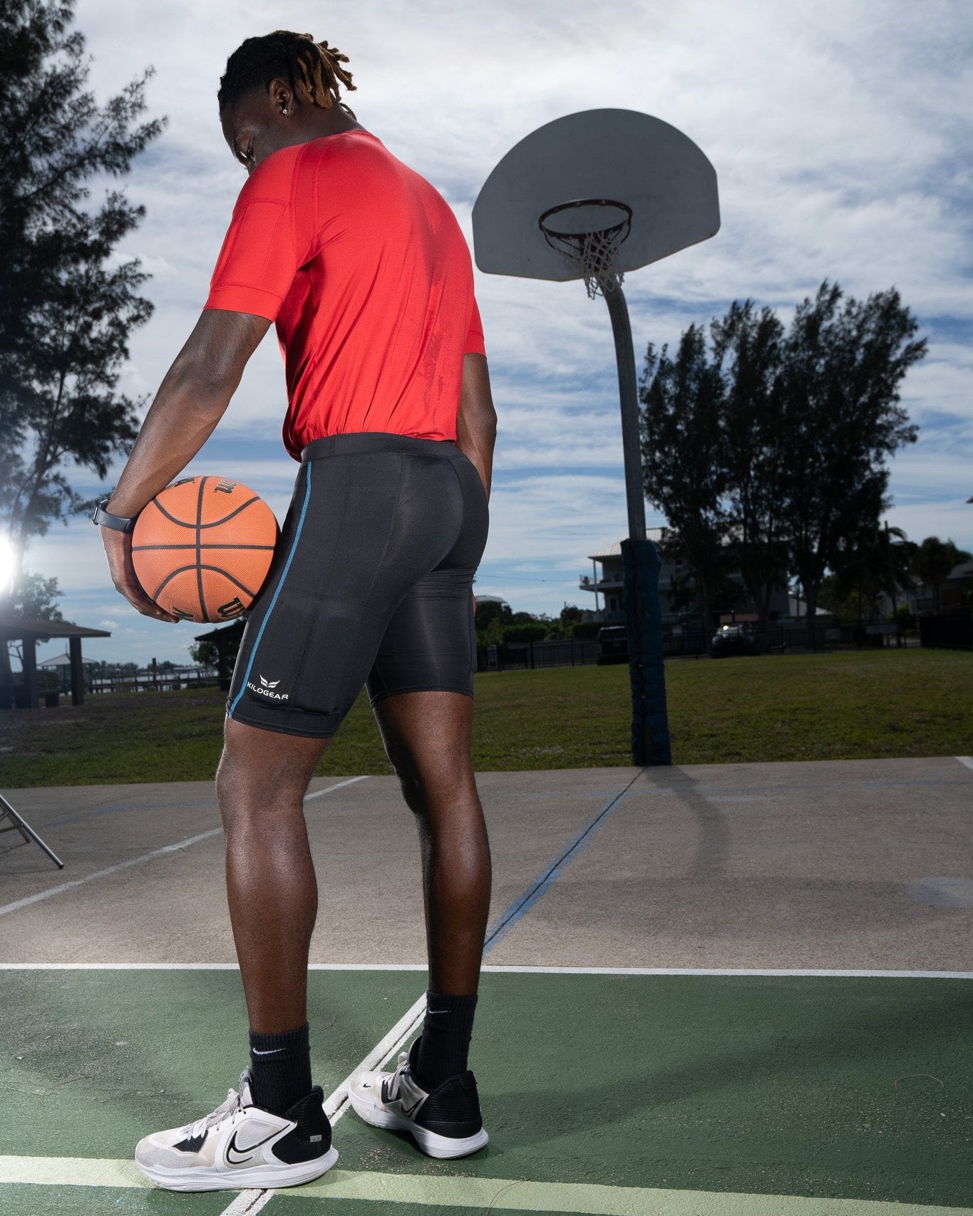 Men's CUT Weighted Compression Short side view showing weights on the quads
