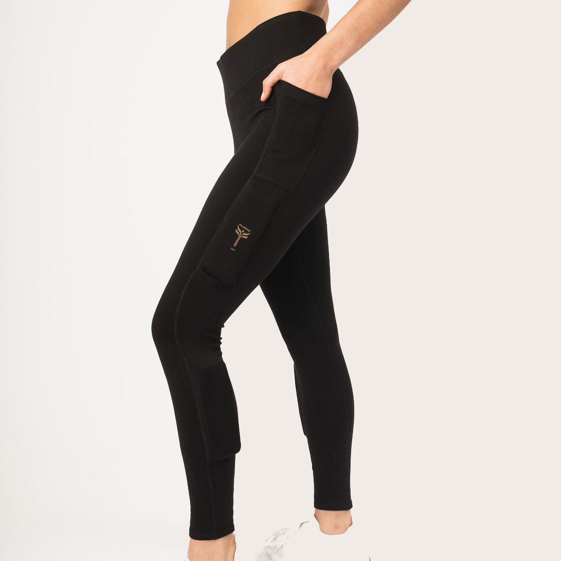 Woman's legs wearing black legging with the weights on the side of the leg above the knee on the quads and on the side of the shin. High waist and full length.