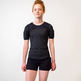 Girl standing with her hands to the side wearing the black weighted short sleeves with weights on the arms and weights on the side of the leg. Black short sleeve has a scoop neck.