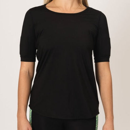 Image showing the scoop neck of the all black relaxed fit short sleeve, weights in the arm pockets and sloped edge off the top.
