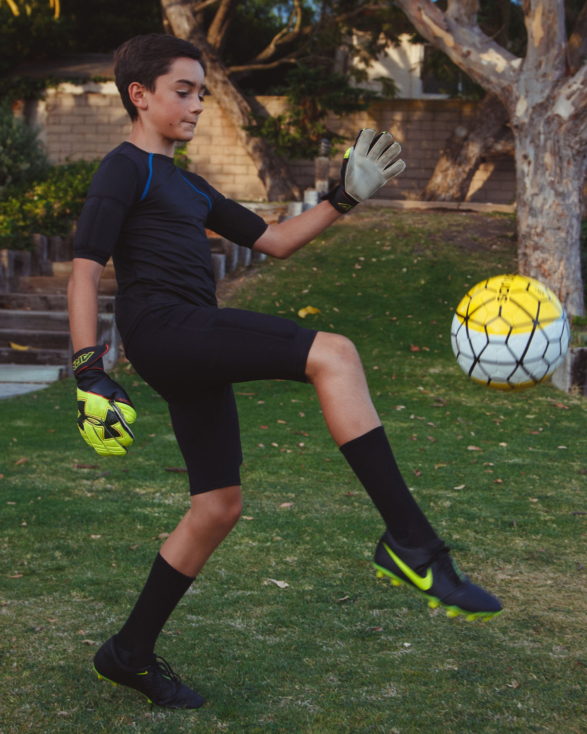 Boy's black weighted training short for sports and strength training.