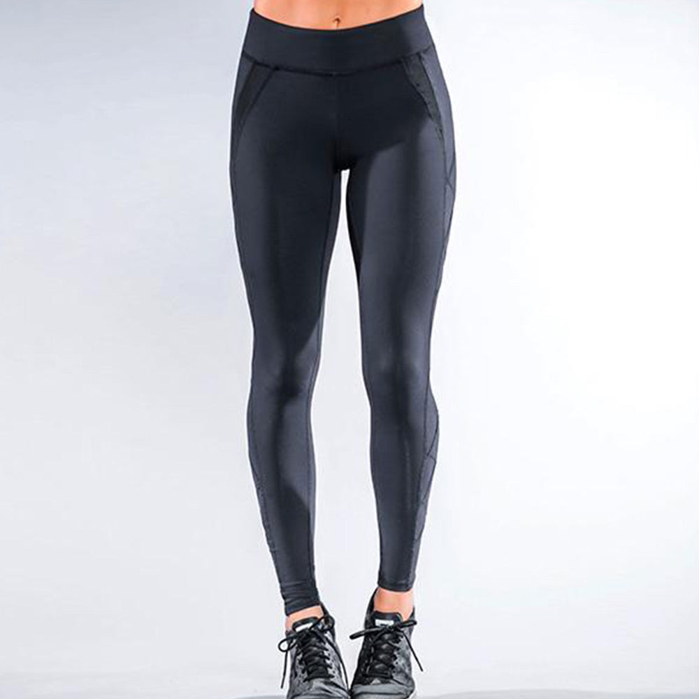 Showing black weighted legging with high weights and weight pockets on the side of each leg. Four total with two above the knee and two below the knee.