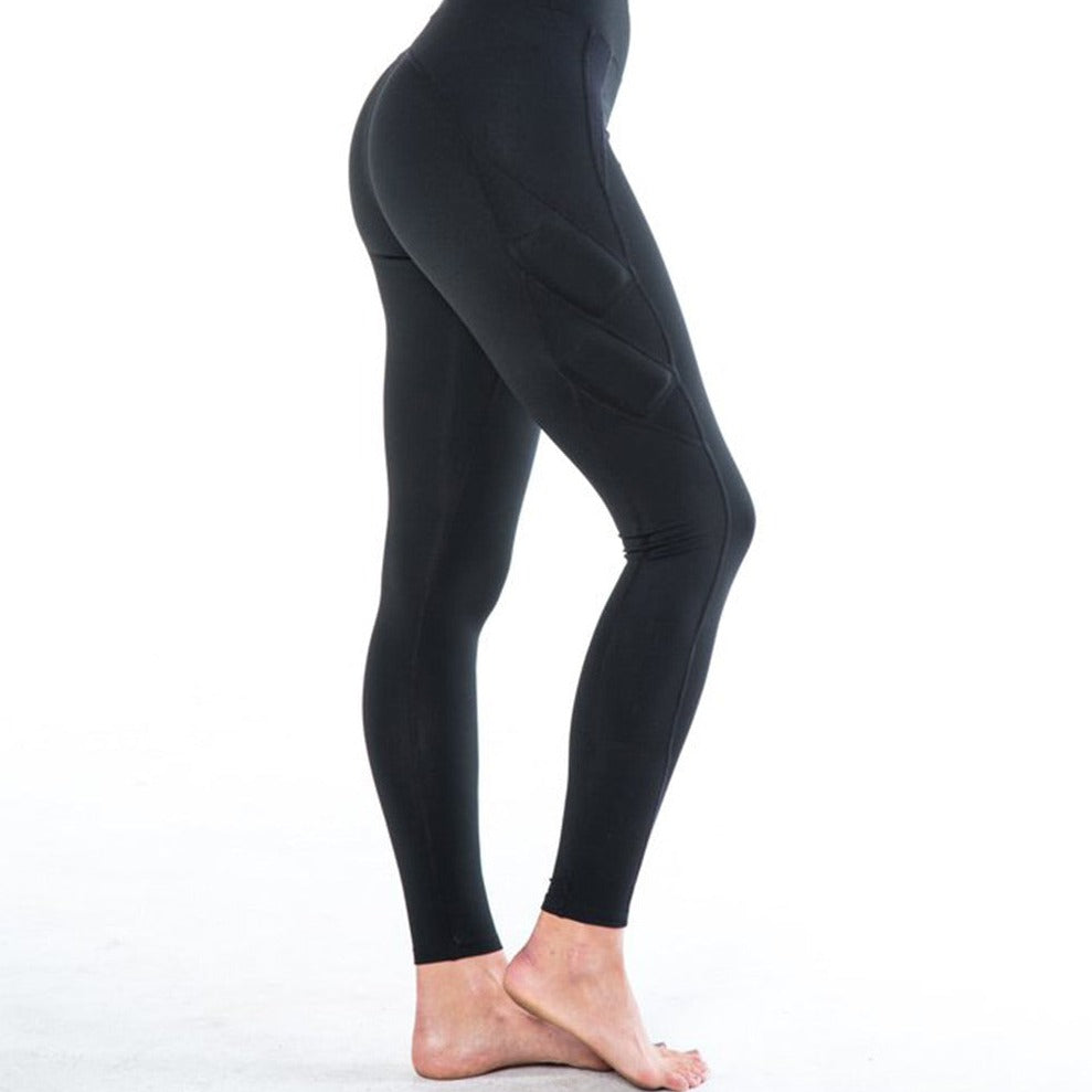 Side view showing one leg - Image showing black legging with high waist and four weight pockets down the leg. The two upper weight pockets above the knee are on an angle, while the two weight pockets below the knee are vertical. The weights are around 3x4 inches.