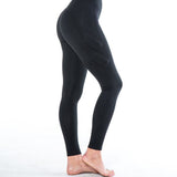 Side view showing one leg - Image showing black legging with high waist and four weight pockets down the leg. The two upper weight pockets above the knee are on an angle, while the two weight pockets below the knee are vertical. The weights are around 3x4 inches.