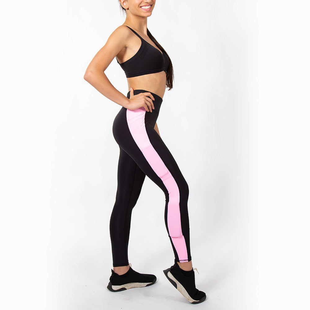 wearing black kilogear cut legging with pink strip running down the side, showing weight in the calf weight pocket and quad weight pocket, side view