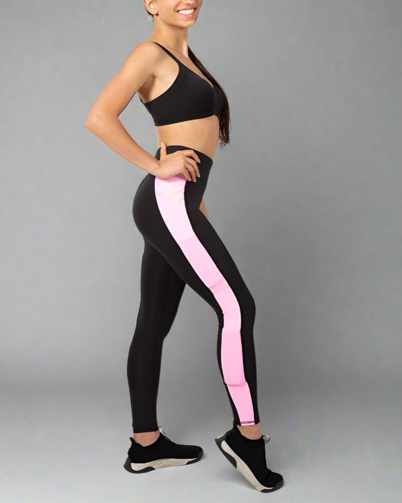 wearing black kilogear cut legging with pink strip running down the side, showing weight in the calf weight pocket and quad weight pocket, side view