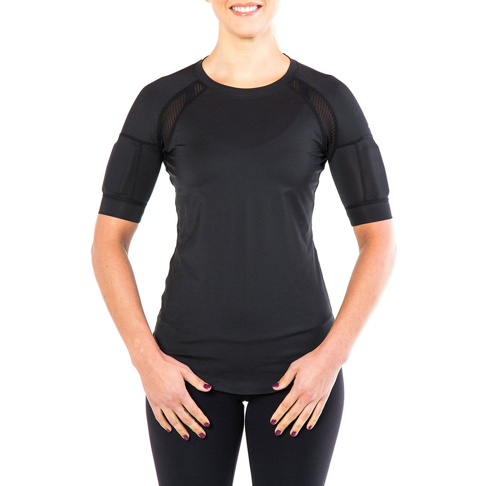 Woman wearing black kilogear cut short sleeve showing weights in the arm pockets