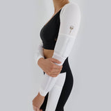 Side view women's weighted white power shrug with weights down the arm